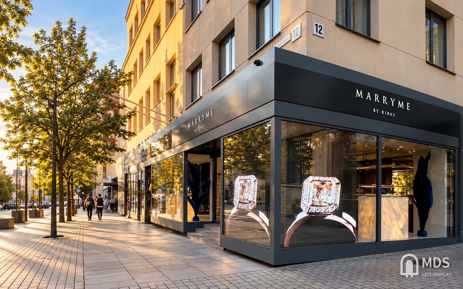 MDS transparent LED display in a jewelry store window, showing ring images while the shop interior stays visible